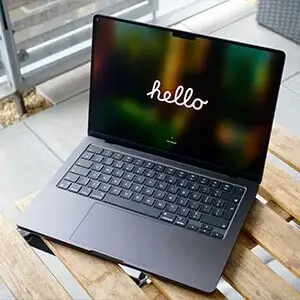 macbook pro on a wooden table